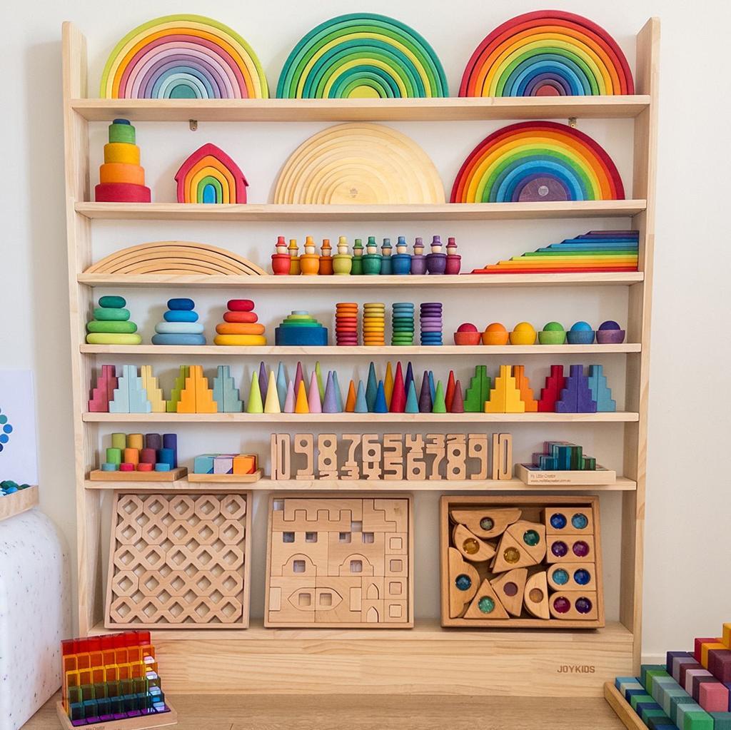 A shelf full of colourful wooden toys